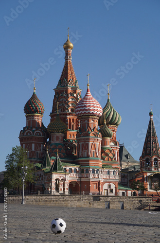 Moscow / Russia – 05.08.2018: vertical image of a soccer ball on the Red Square in Moscow in front of the Saint Basil's Cathedral, the ball on the left