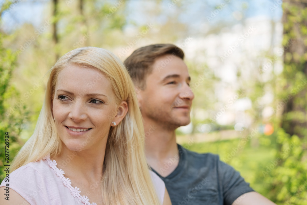 Young couple outdoors in a garden Young couple outdoors in a garden