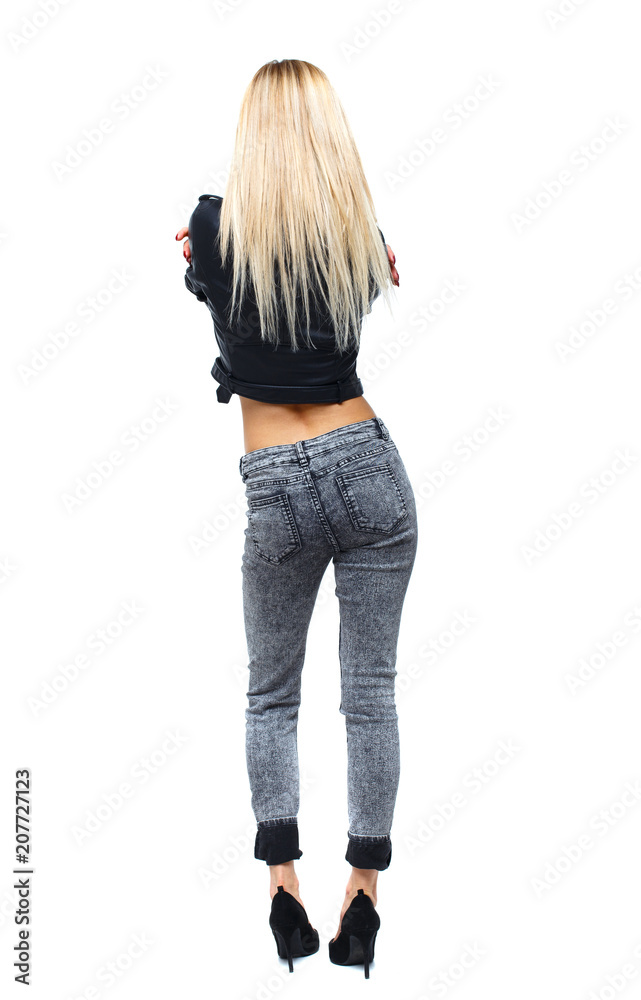 Obraz premium Back view of a woman standing.