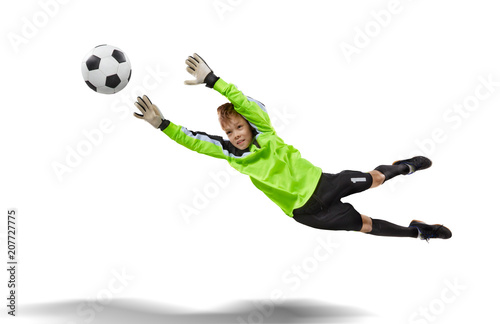 goalkeeper kid flying for the ball isolated on white