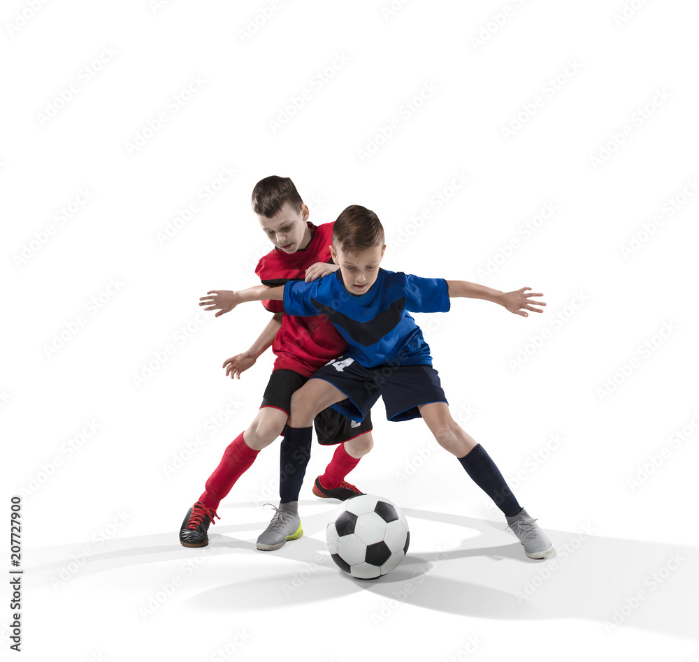 two teenage fotball players struggling for the ball isolated on white