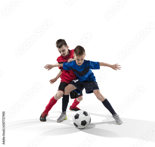 two teenage fotball players struggling for the ball isolated on white © 27mistral