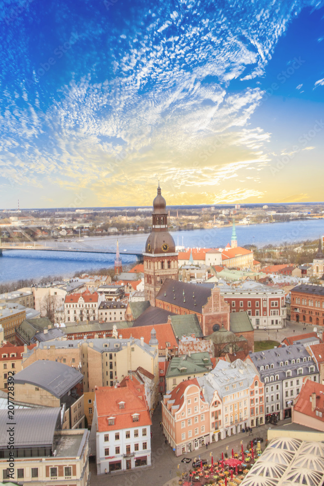 Fototapeta premium Beautiful view of the old town and the steeple of the Dome Cathedral near the Daugava River in Riga, Latvia
