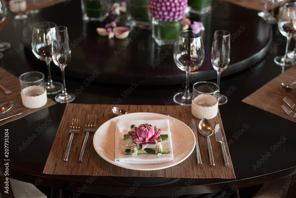 Beautiful luxury dinner table setup using pink lotus of Thailand