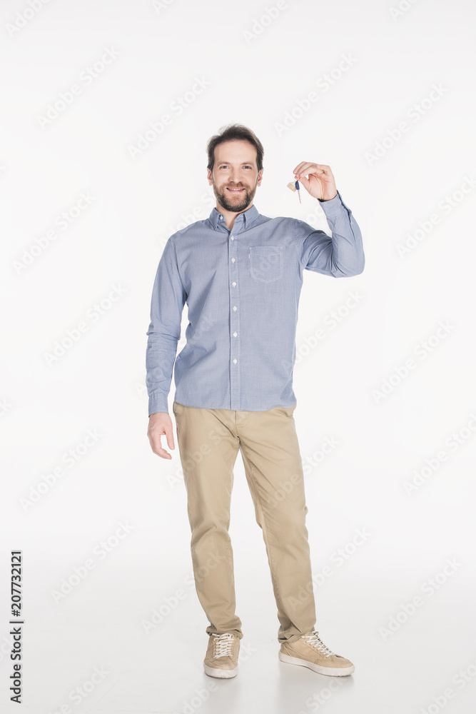 smiling bearded man showing key from new house in hand isolated on white smiling bearded man showing key from new house in hand isolated on white