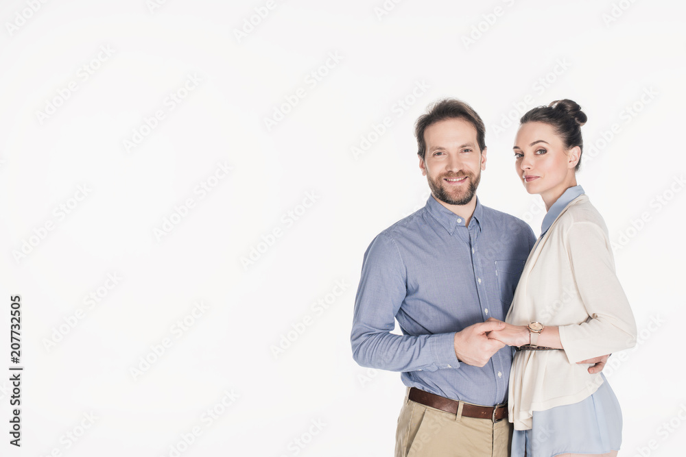 portrait of smiling married couple holding hands together isolated on white portrait of smiling married couple holding hands together isolated on white