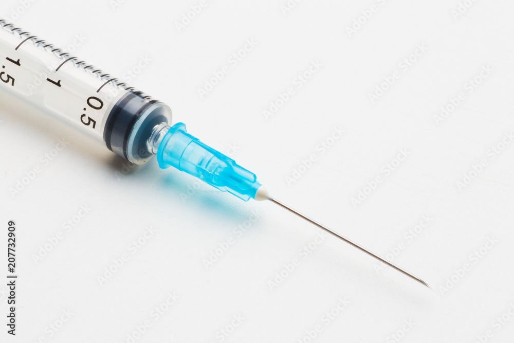 Disposable syringe in the row Disposable syringe in the row