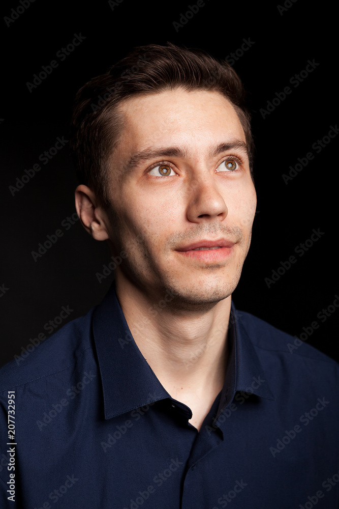Fashion portrat of young man on black background in studio photo Fashion portrat of young man on black background in studio photo