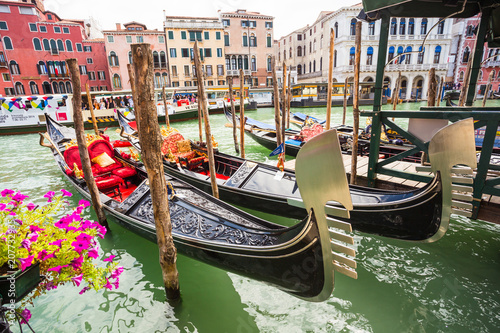 Tourists travel on gondolas at canal