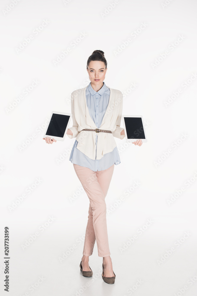 woman showing tablets with blank screens in hands isolated on white woman showing tablets with blank screens in hands isolated on white