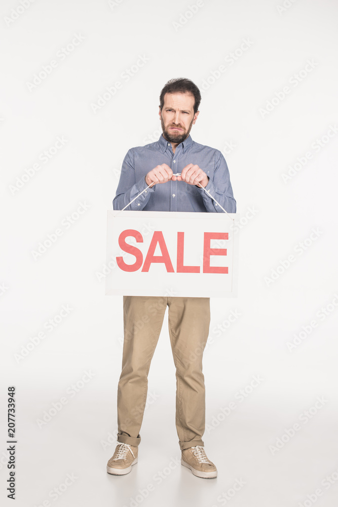 upset man with sale card isolated on white upset man with sale card isolated on white
