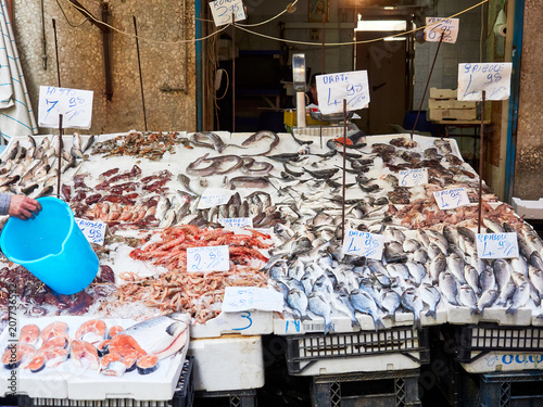 Napoli, April 26, 2018.   Stand selling  fish, squid, and other seafood at the Porta Nolana seafood market in Napoli photo