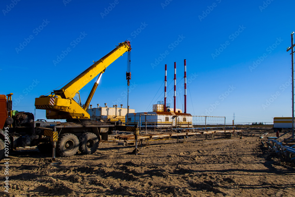 car crane works on the construction site