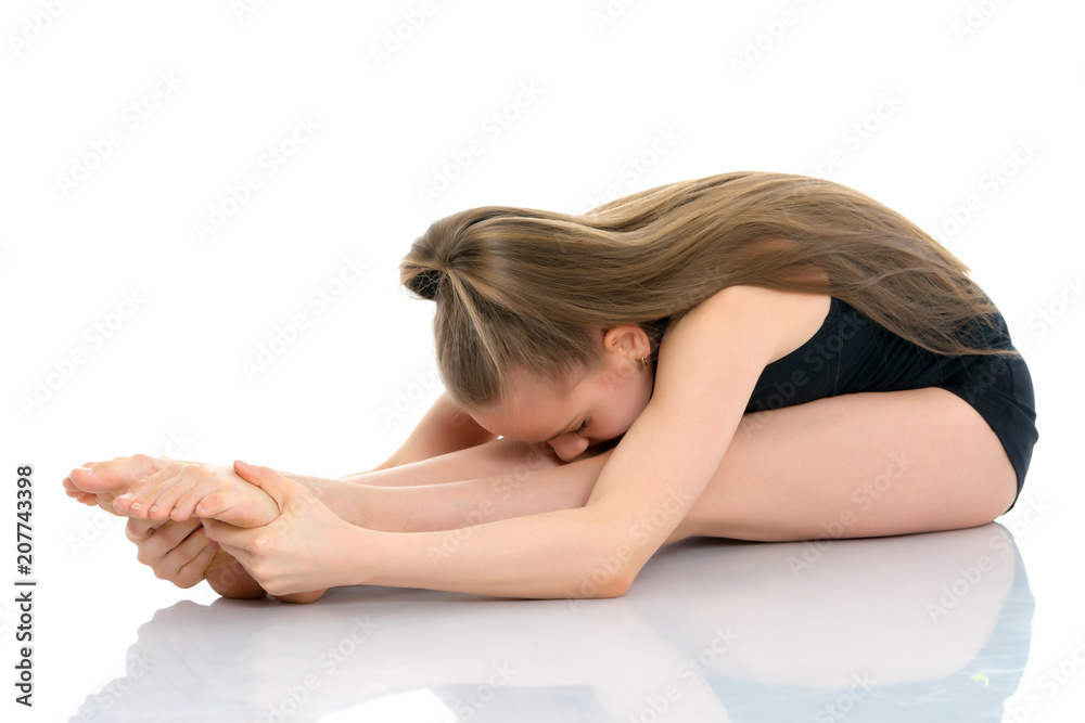 The gymnast perform an acrobatic element on the floor. The gymnast perform an acrobatic element on the floor.