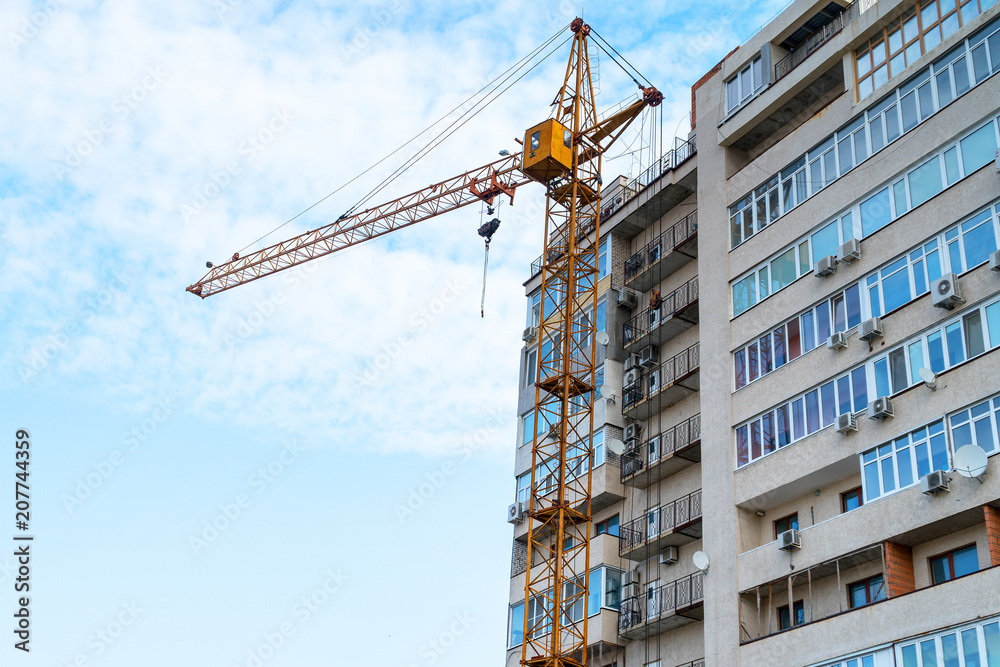 Construction crane against the building Construction crane against the building