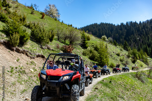 Valokuva A tour group travels on ATVs and UTVs on the mountains