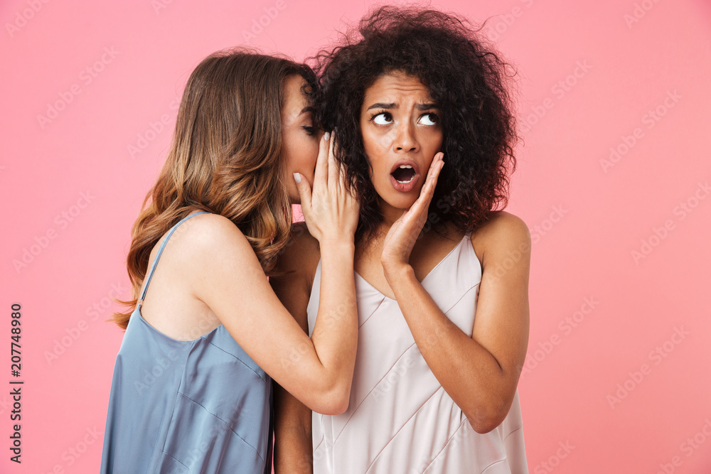 Two shocked young girls dressed in summer clothes Two shocked young girls dressed in summer clothes