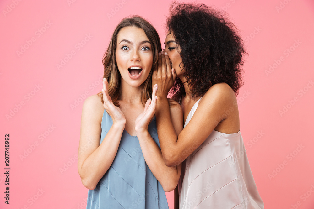 Two excited young girls dressed in summer clothes - obrazy, fototapety, plakaty 