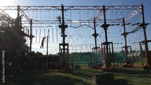 Children are playing in a rope park