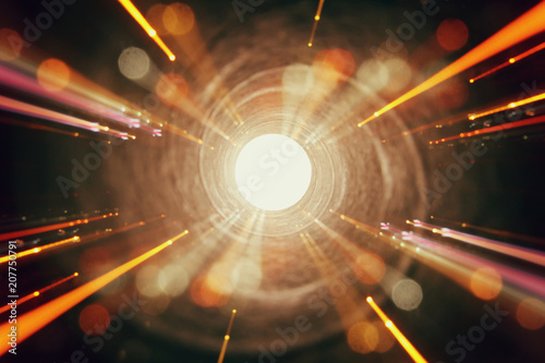 Abstract lens flare. concept image of space or time travel background over dark colors and bright lights photo