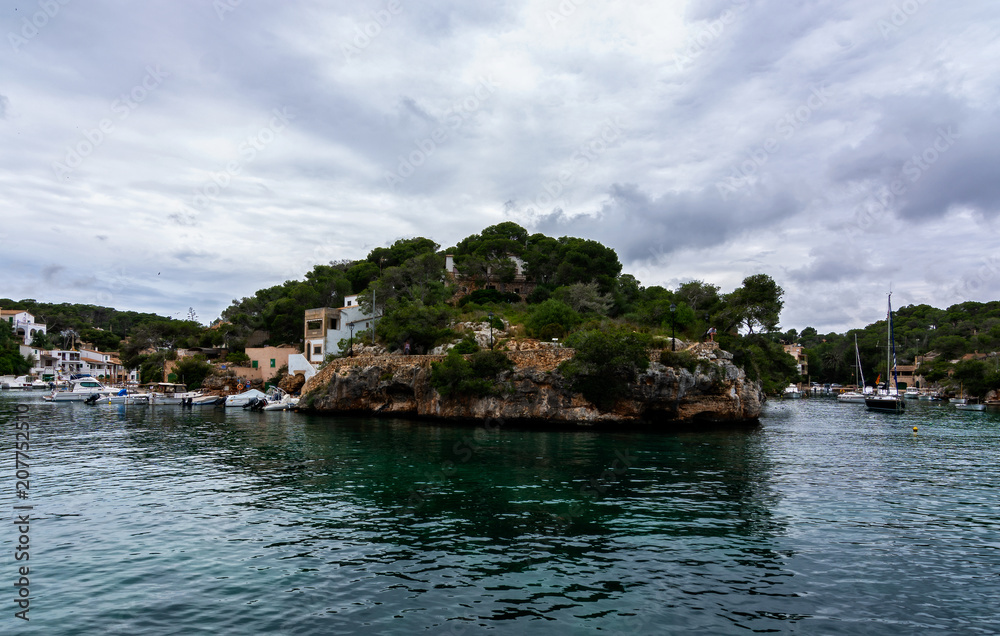 Picturesque small harbor in the south of Mallorca, Balearic islands, Spain. Mediterranean seascape.