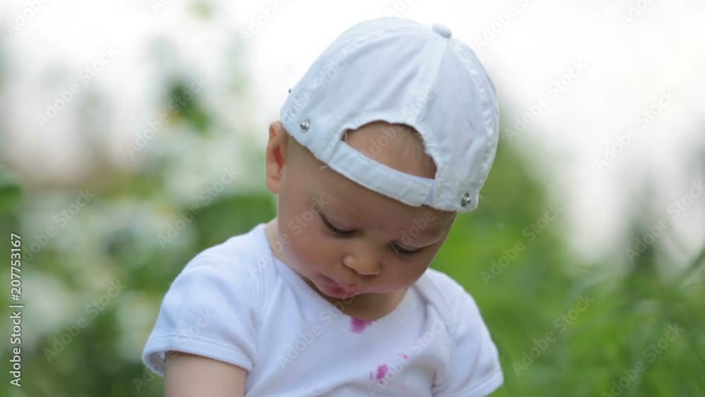 Sweet little child, baby boy, eating cherries in garden, enjoying tasty fruit, getting dirty Sweet little child, baby boy, eating cherries in garden, enjoying tasty fruit, getting dirty