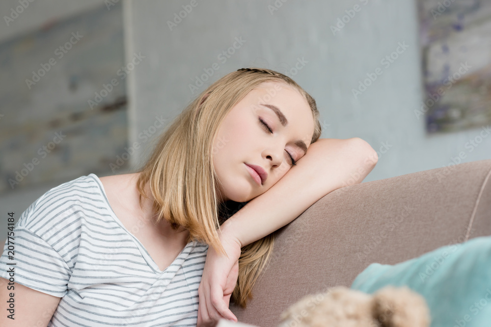 close-up portrait of teen girl sleeping while sitting on couch close-up portrait of teen girl sleeping while sitting on couch