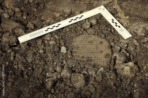 Cuneiform writing of Akkad Empire in brown clay found on summer terrain excavations photo