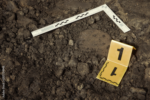 Cuneiform writing of Akkad Empire in brown clay found on summer terrain excavations photo