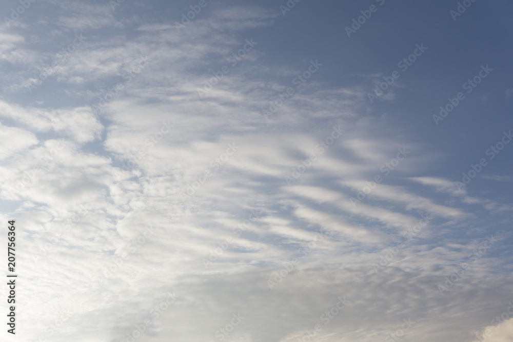 Blue sky background with clouds .
