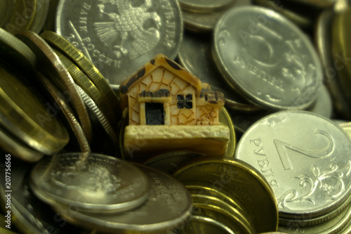 Saving to buy a house or home savings concept with money coin stack growing aving money concept. photo