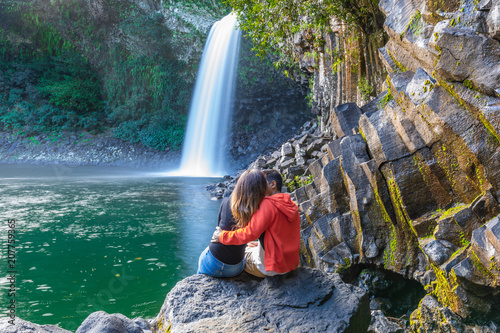 Couple kissing under the Bassin La Paix waterfall in Reunion Island