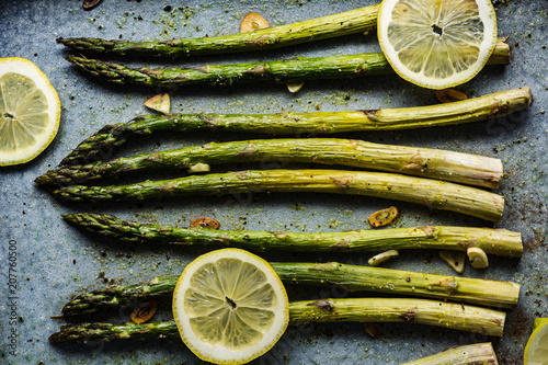 Roasted green asparagus with lemon, pepper, salt and garlic