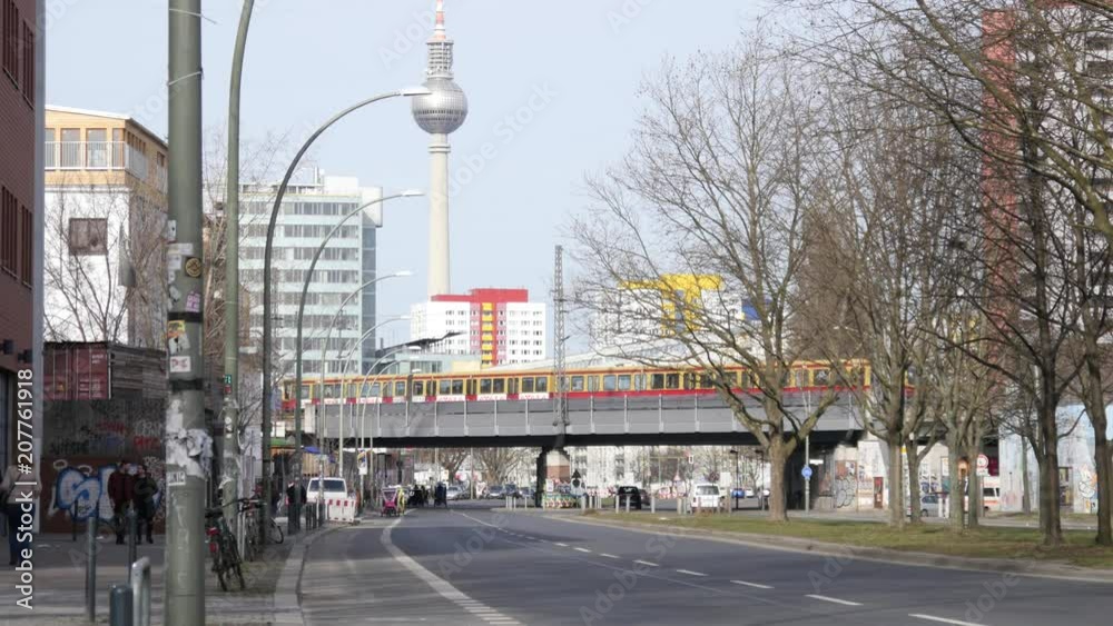 Morning in Berlin, streets and buildings, traffic and people, trains and cars