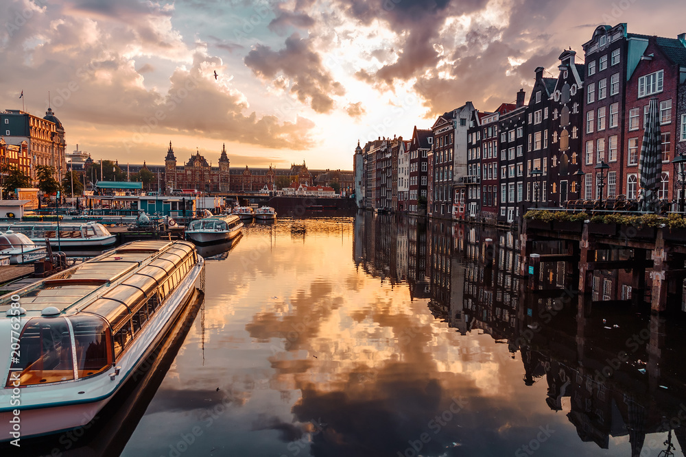 sunrise over the traditional Amsterdam houses on the Domarik canal