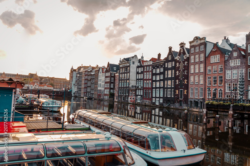 sunrise over the traditional Amsterdam houses on the Domarik canal