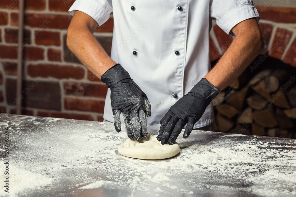 chef making dough for pizza. Man hands preparing bread. Concept of baking and patisserie chef making dough for pizza. Man hands preparing bread. Concept of baking and patisserie