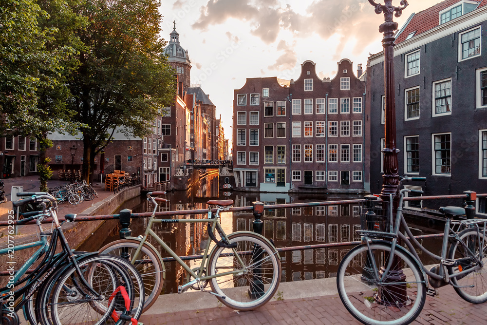 sunrise on the streets and canals of amsterdam