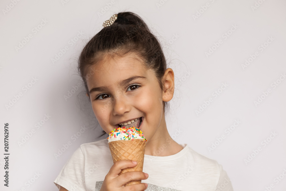 Happy and cute child girl eating ice cream Happy and cute child girl eating ice cream
