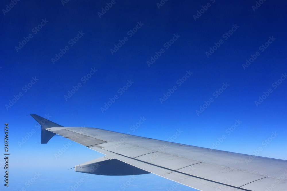 Wing of an airplane in the sky