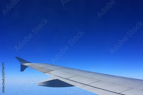 Wing of an airplane in the sky