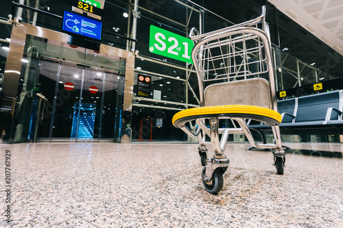 Luggage cart trolley at modern airport gate