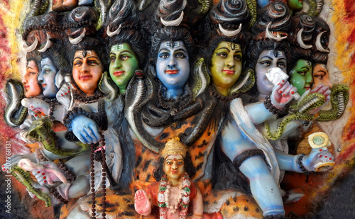 Closeup of Wall art Statue of Hindu God Shiva and Kumara swamy in a temple