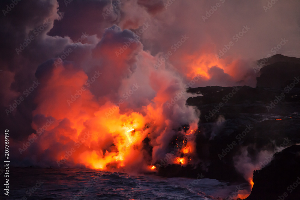 Lava ocean entry at night billowing steam on Hawaii, Big Island