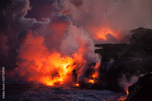 Lava ocean entry at night billowing steam on Hawaii, Big Island