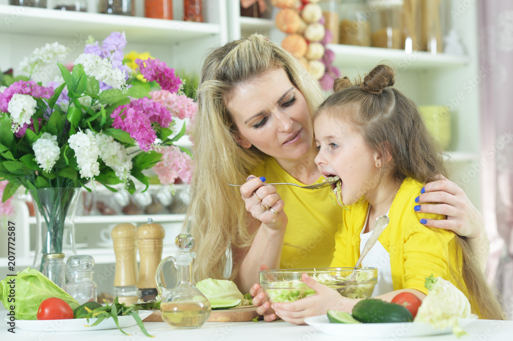 mother and daughter cooking together