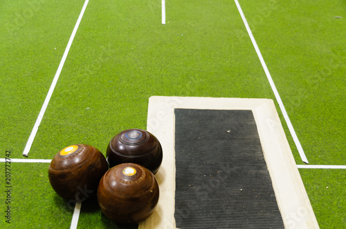 Bowls on an indoor bowls carpet photo