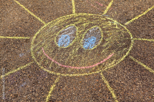 A child's drawing of sun on a stree