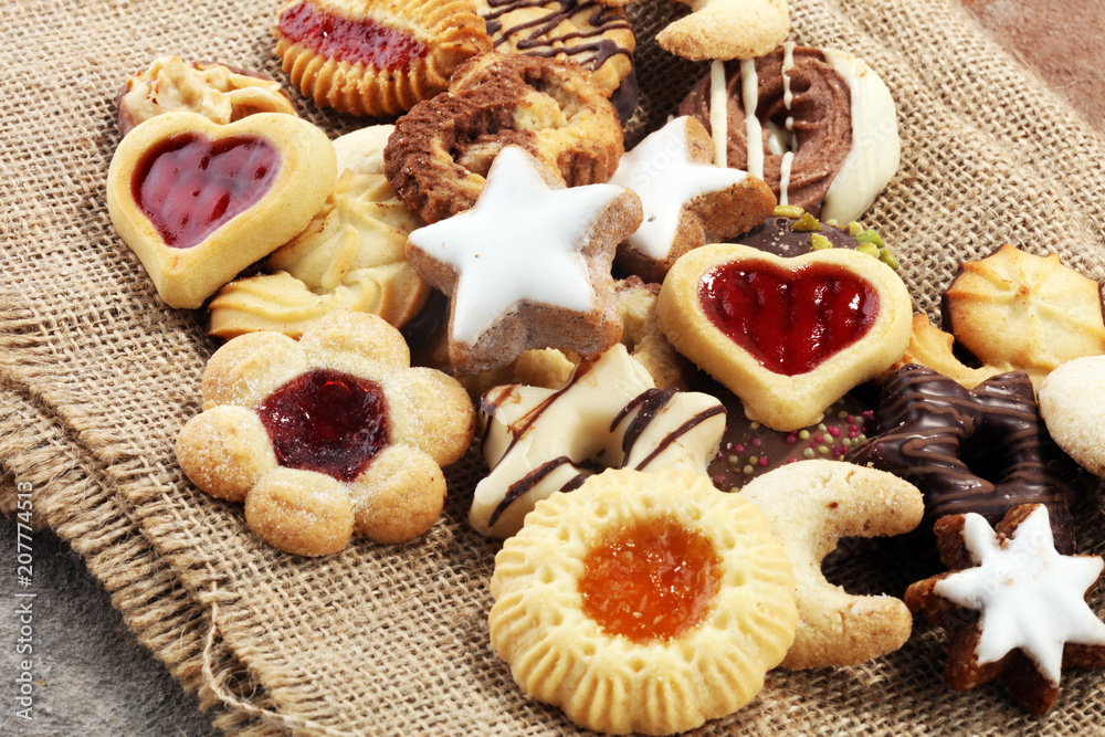 Fototapeta premium Mixed Christmas cookies. Colorful mix of Christmas-themed decorated cookies