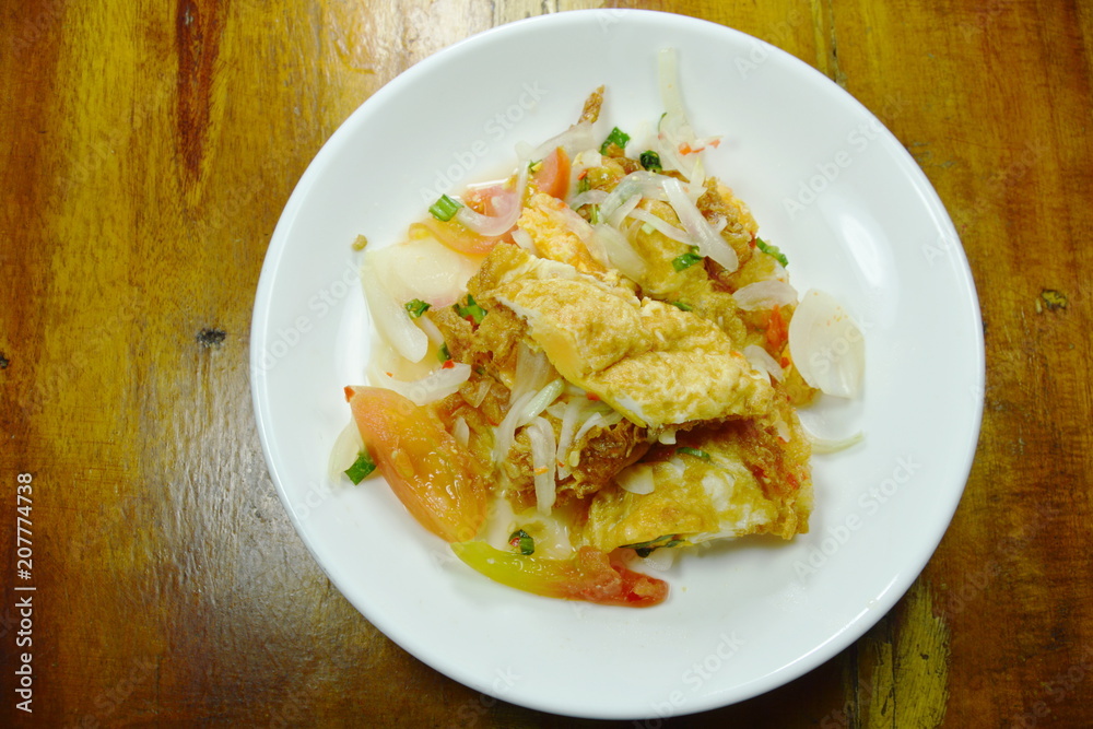 fried egg in spicy and sour sauce salad on plate fried egg in spicy and sour sauce salad on plate